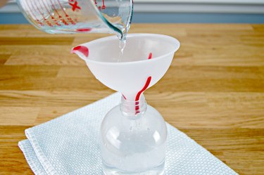 Adding water to spray bottle
