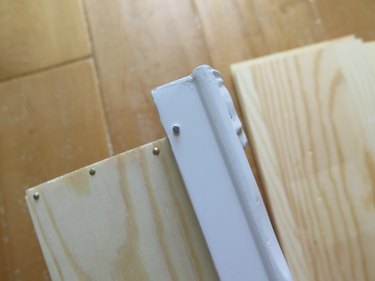 After nailing the frame to the box.