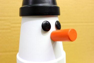 cork nose glued to snowman's face