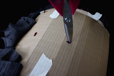 cut two holes for the rope