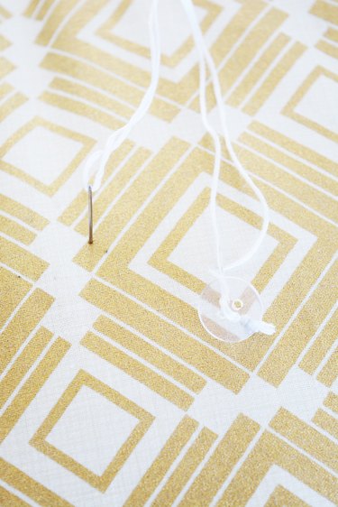 Add tucks to the pillow.