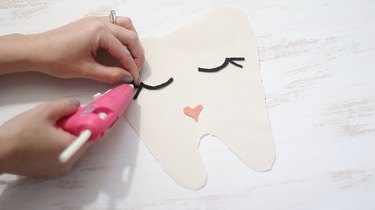 Gluing eyes to fabric