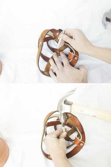 Attaching rivet to support straps.