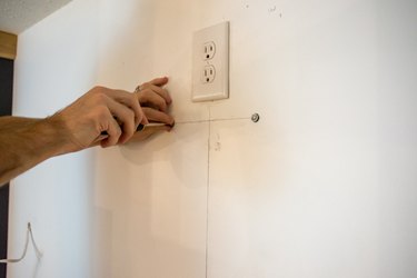 Add drywall screws for range hood