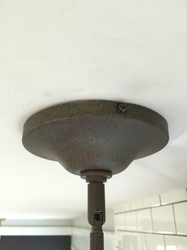 Screw the canopy in to attach the light.