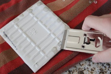 Removing the drips with a razor blade