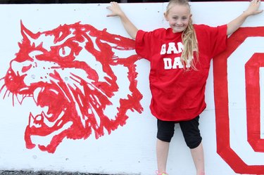 before photo of little girl wearing a too-big shirt