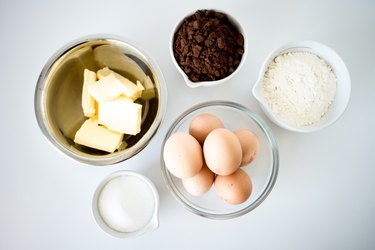Several bowls, each containing a pre-measured item from the ingredient list.