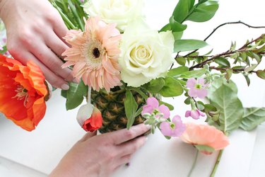 Arrange flowers into your pineapple vase