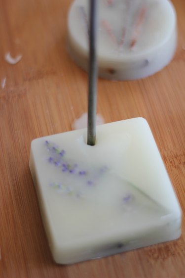 Use a candle or flame source to heat up a nail or steel skewer.
