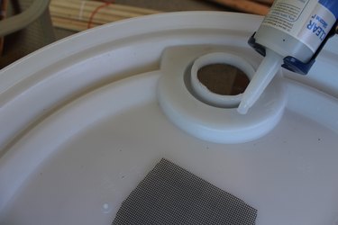 Applying the silicone for the screen.