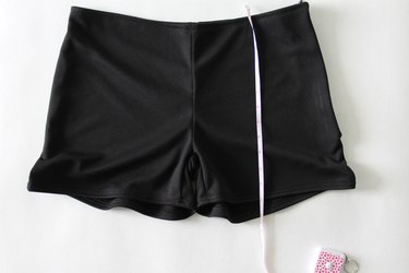 Measure from the waistband to below the hem