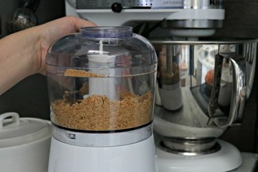 Food processor filled with breadcrumbs