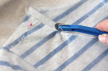 Use a tracing wheel to trace the lines onto the dress.