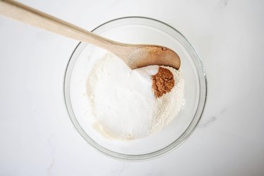 Mixing together the dry ingredients.