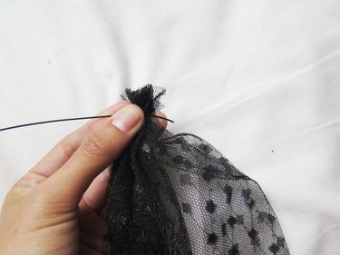 Securing the veil scrunch with wire.