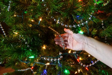 Drape beads around the tree