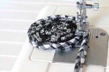 wind the rope into a coil and stitch with zig zag