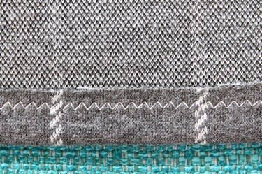 Back view of a hem sewn with a zig zag stitch.