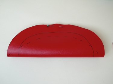 Circle folded in half with a arch marked from point to point.