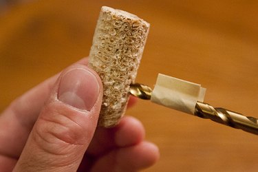 Drill a hole for the stem but do not drill all the way through the cob.