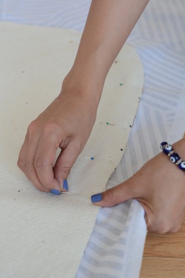 Pin the batting to the fabric.