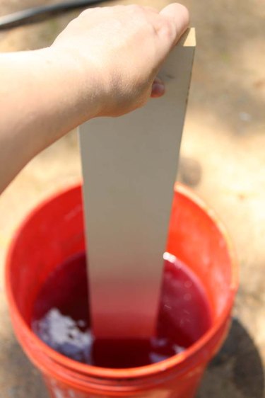 Stir the dye into the hot water.