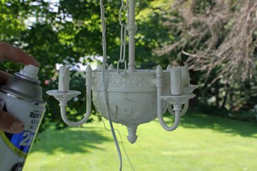 Paint the chandelier in thin, light coats.