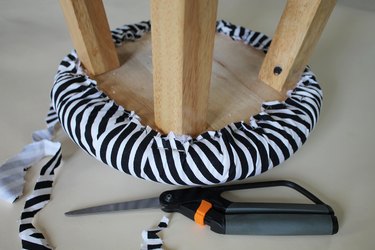 Finish the upholstered stool.