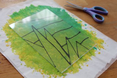 Painted acrylic on top of the wax paper crayon page with a pair of scissors nearby