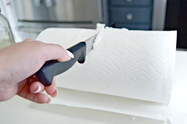 Cutting roll of paper towels