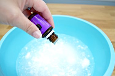 Add essential oil to bowl