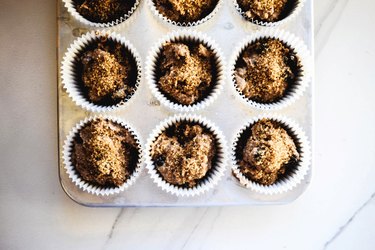 Divide the mixture between the paper liners and sprinkle with sugar.