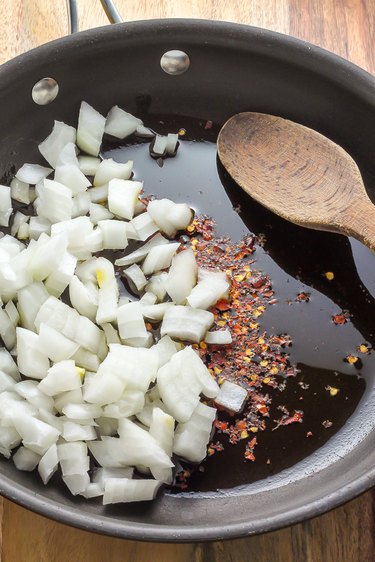 onion and red pepper in pan