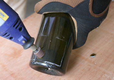 Sanding a glass bottle