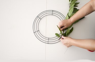 Tie olive greens to wreath