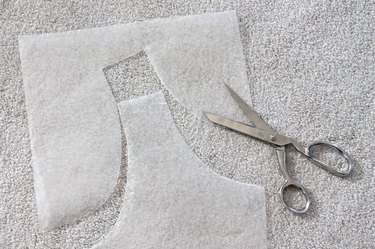 Cut the wax paper along the lines.
