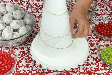 Arrange twine on cone.