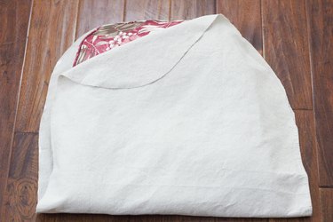 Folding fabric over the cushion