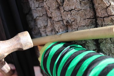 Placing the broom for the witch's ride.