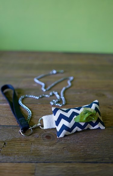 DIY dog waste bag dispenser and dog waste bag roll clipped to leash