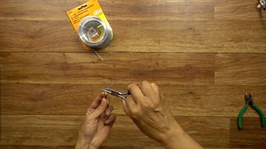Preparing wire for DIY glass beaded garden sparkler.