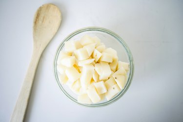Boiled and cubed potatoes in a bowl.
