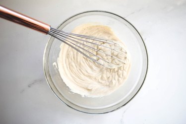 Whisking together the liquid ingredients.