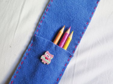 Colored pencils placed into the DIY felt pencil case