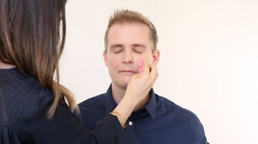 Applying foundation with beauty blender