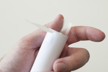 Prepare tape to secure the paper circles