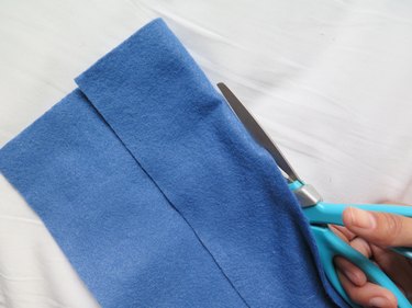 Cutting the felt along the fold for a DIY pencil case