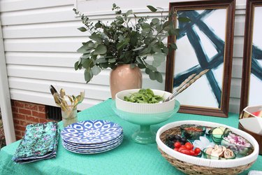 Layered serving dishes with ice create a simple to maintain summer buffet.