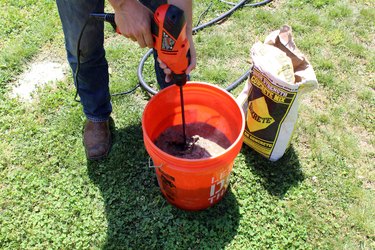 mix concrete and water with paddle attachment and drill